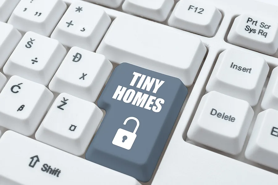 Tiny homes key with a padlock on a computer keyboard