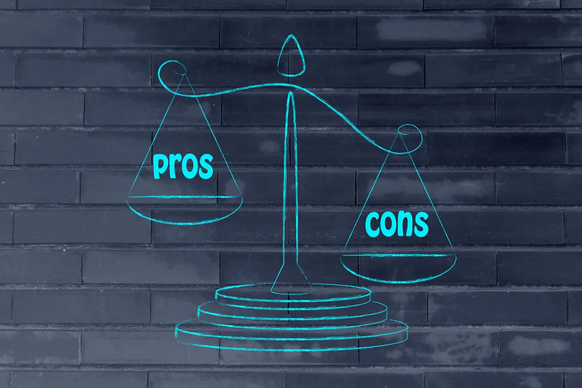 Pros and cons comparison drawn on a chalkboard