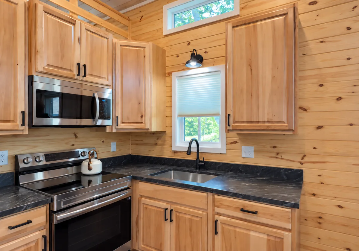 Tiny home kitchen with hickory cabinets
