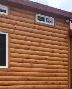 Log-style siding on a tiny home exterior
