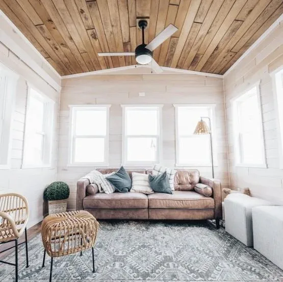 A comfortable tiny home living room with a sofa