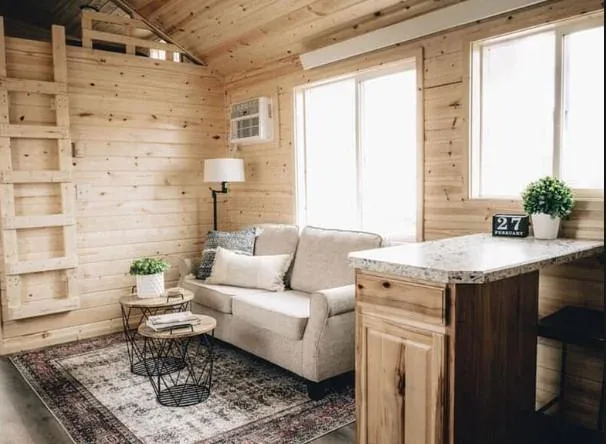 An open-concept living room and kitchen in a tiny home