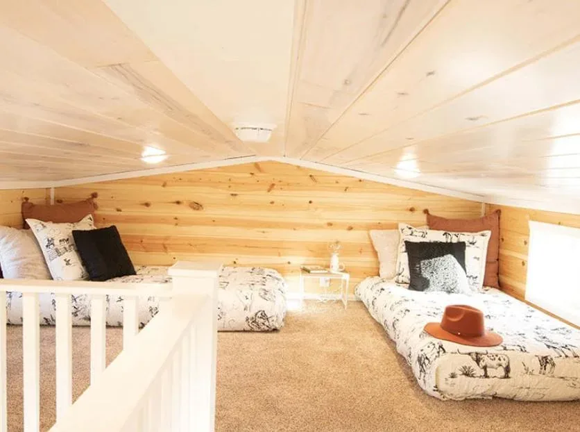 A sleeping loft in a park model tiny home
