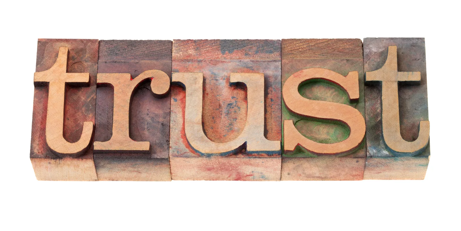Trust spelled with wooden letterpress blocks