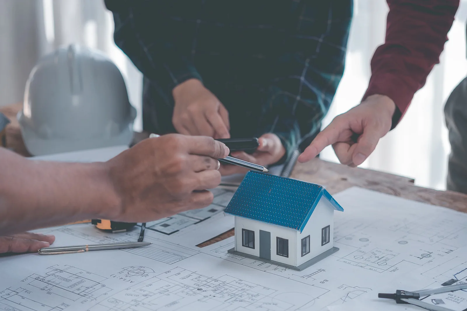 Construction professionals reviewing plans together